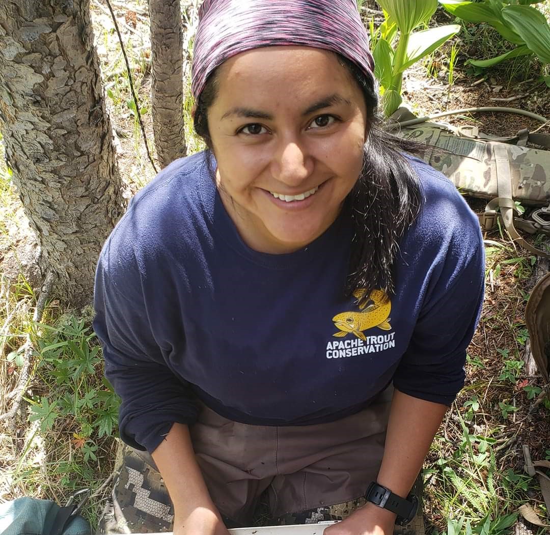 Photo of Cynthia Dunkleberger kneeling on the ground